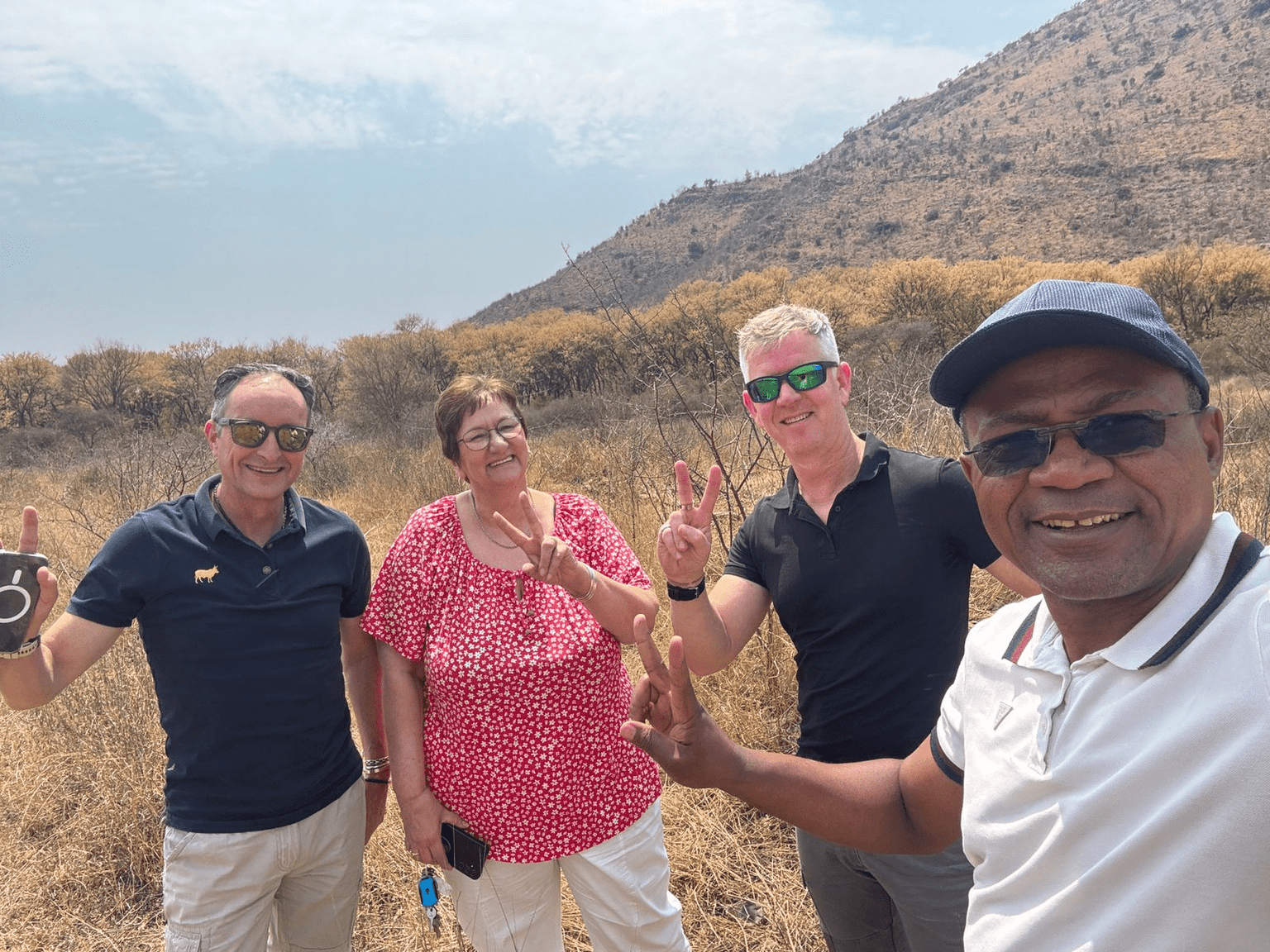 TerraFerm Africa team on degraded land with mountains
